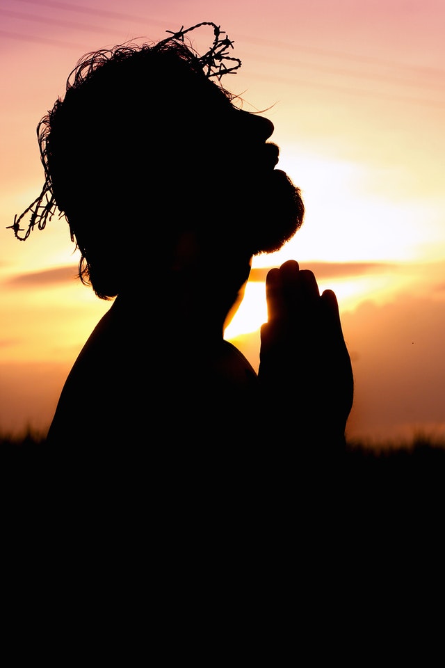Religious Doctrine Silhouette Image of Person Praying by Rodolfo Clix